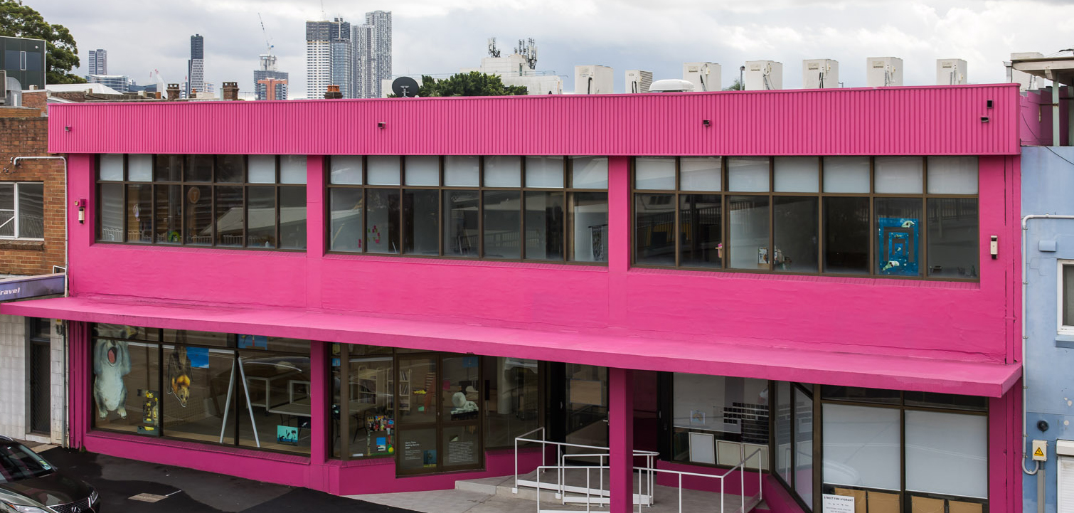 A large two-storey pink building