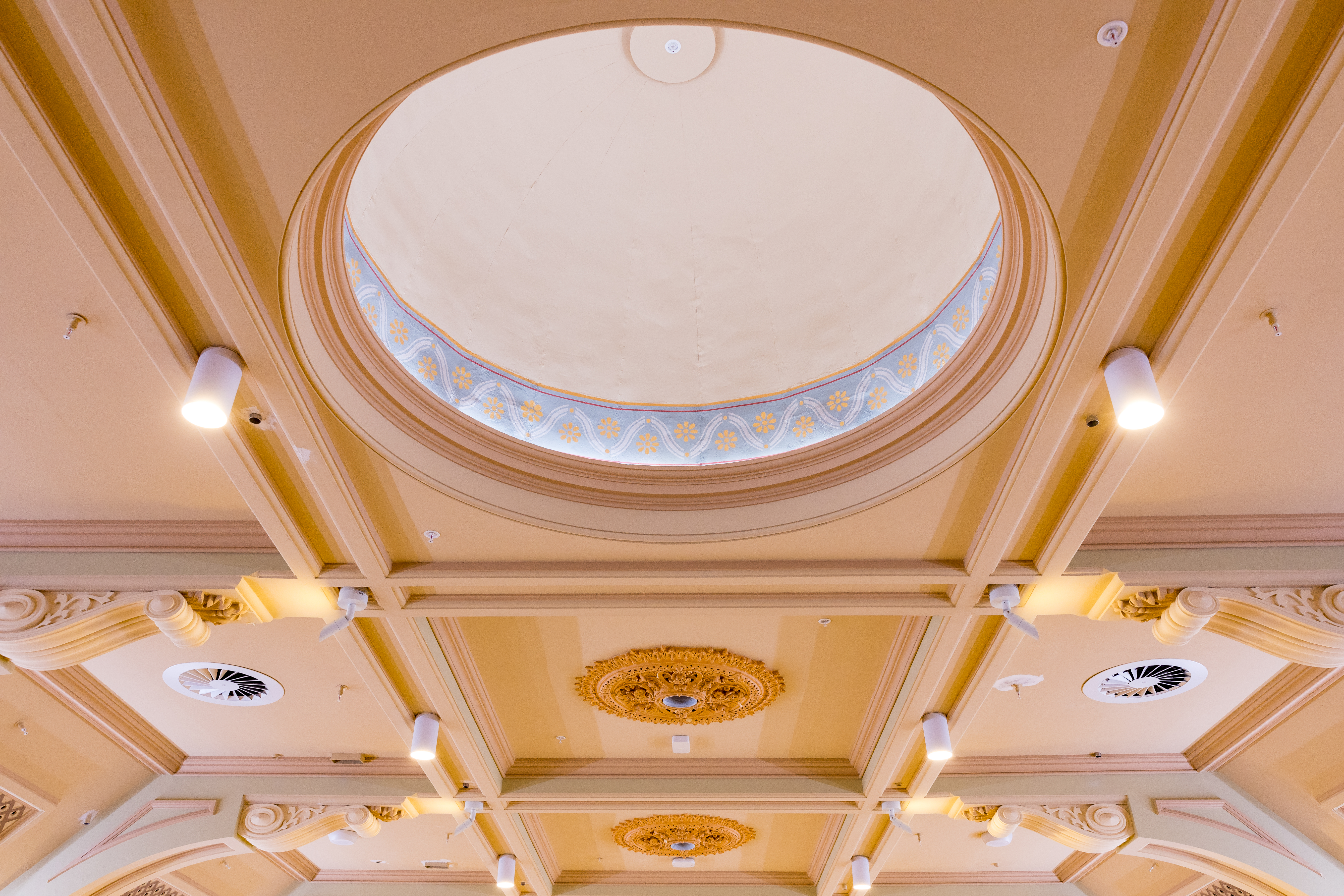 Brightly lit image of the ceiling in the great hall, showing the intricate details