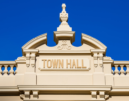 Close up of the word's 'Town Hall', which are visible on the top of the building's exterior