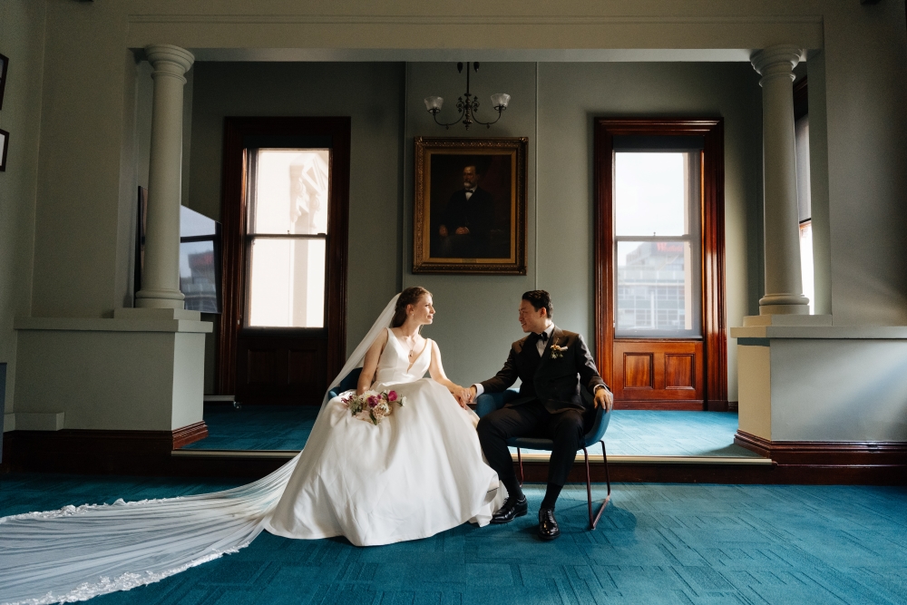 Ally and Tasman sitting on couch in Parramatta Town Hall