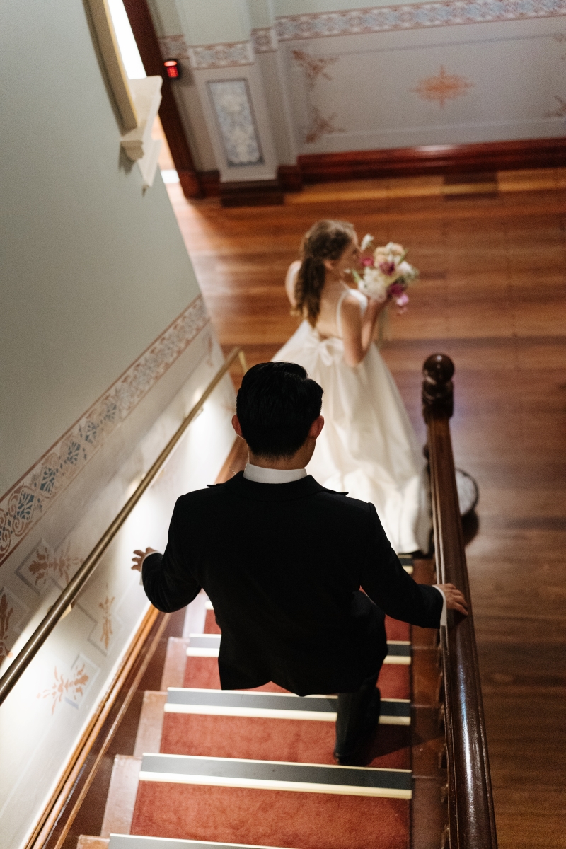 Ally and Tasman walking down the stairs