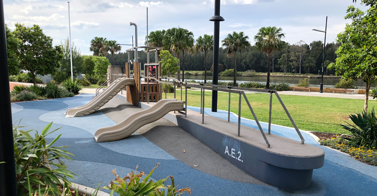 Playground in shape of a ship with two slides and stairs