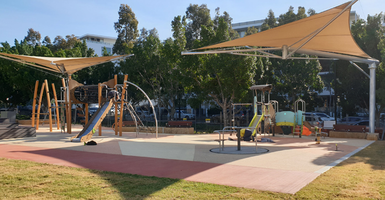 Playground in two sections covered by shade cloth