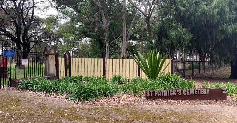 St Patrick's Cemetery sign, fence with entrance to cemetery