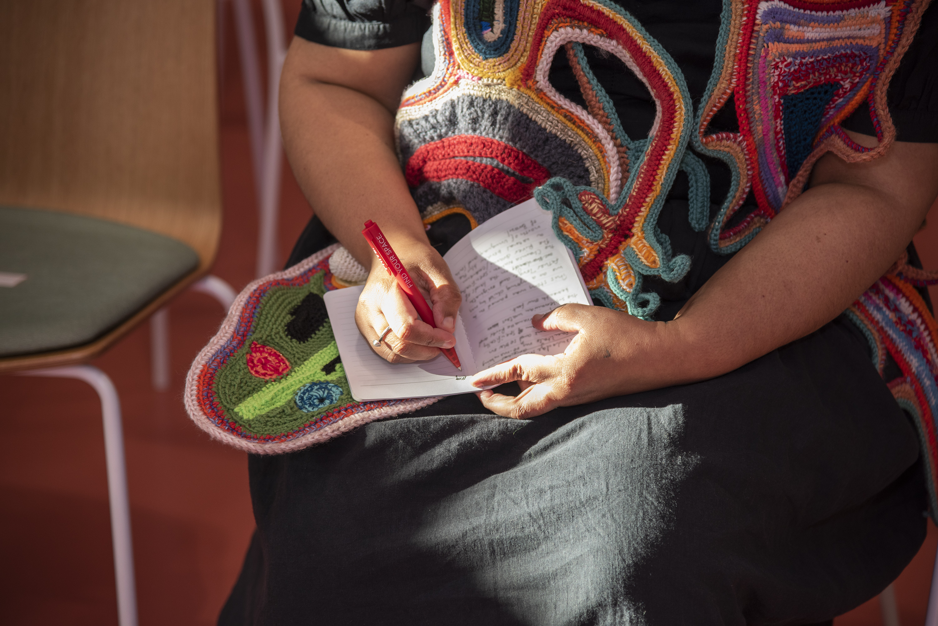 Person writing in notebook