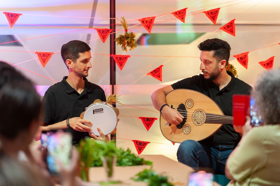 two men playing mandolin