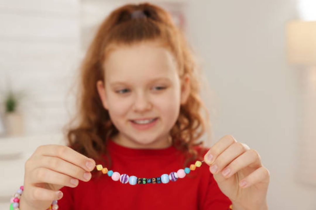 Young girl holding a friendship bracelet