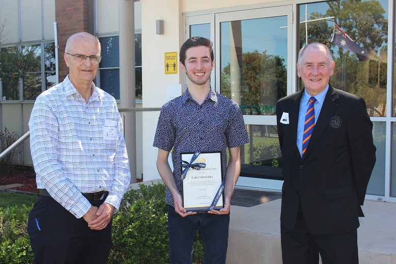 Lord Mayor Cr Bob Dwyer (right) presents local student Luke Sheridan with the 2020 John McClymont History Prize with Jeff Allen from the Parramatta & District Historical Society (left).