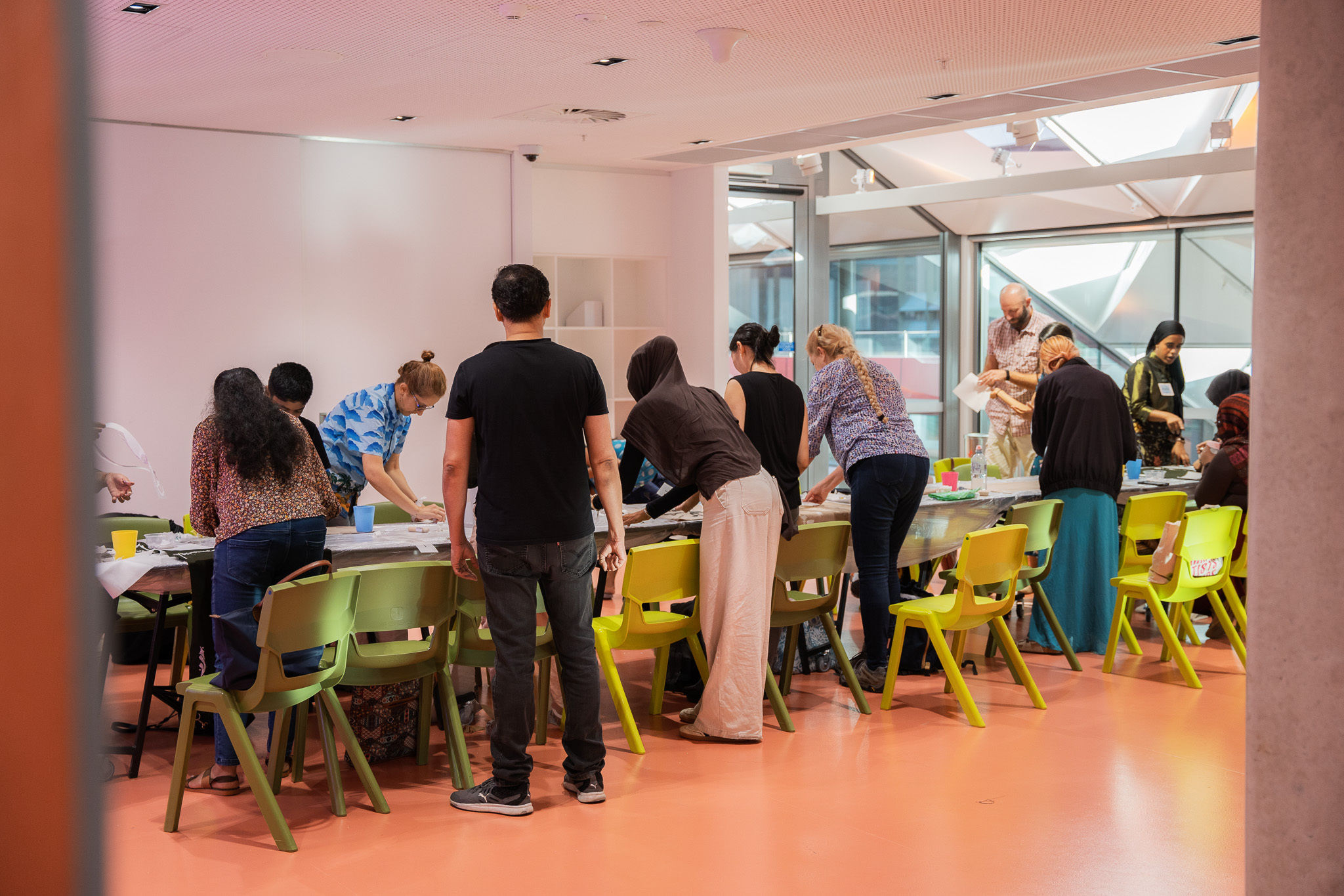 Group of people standing around table