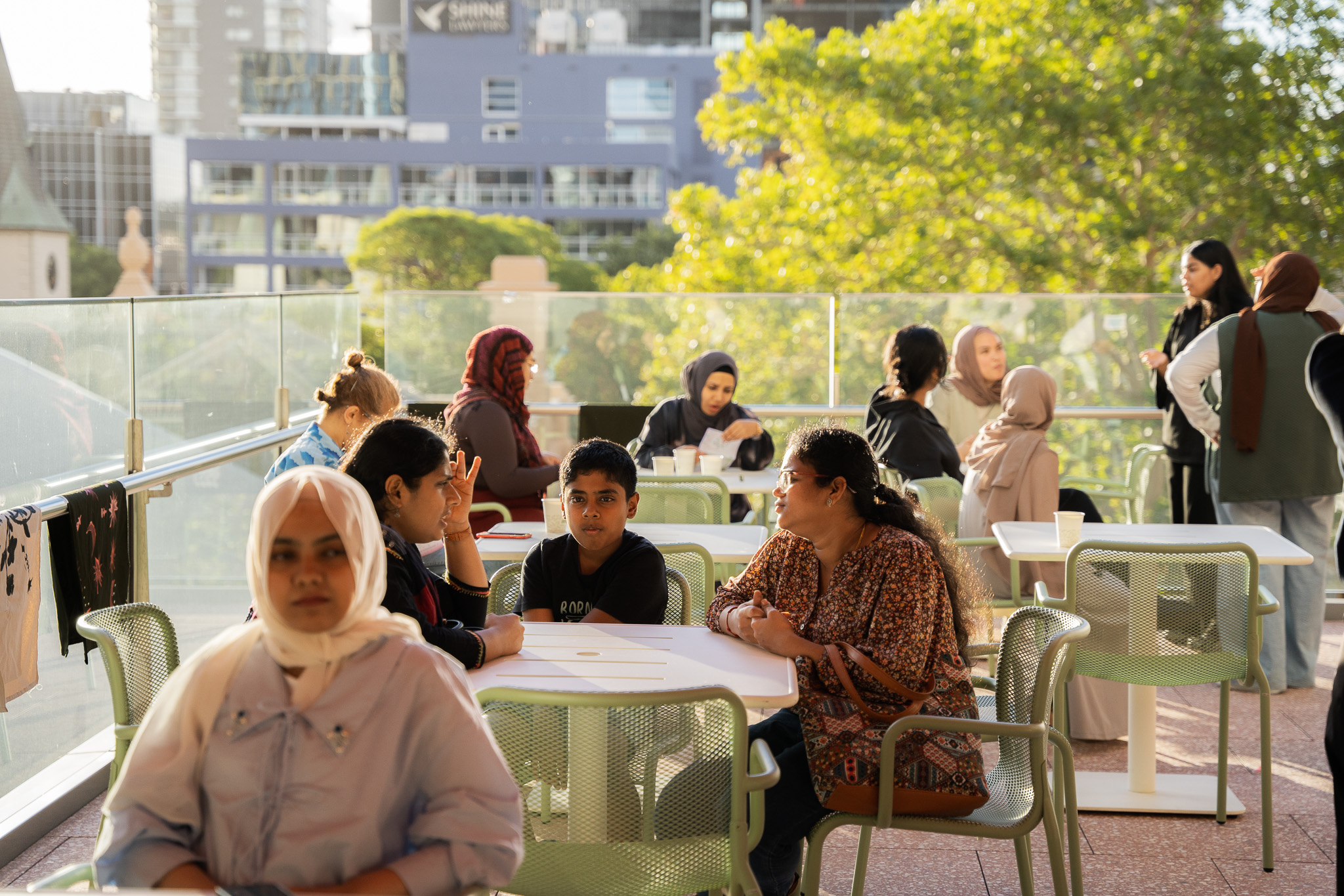 People sitting at tables on the Western Terrace