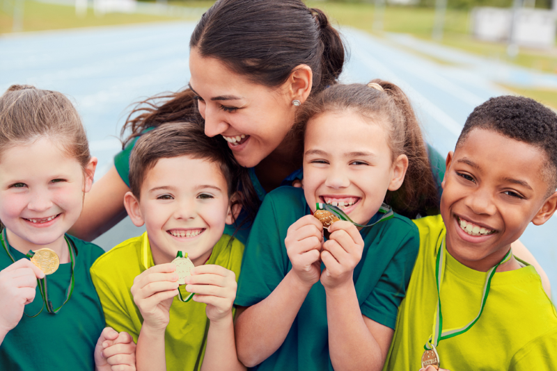 Women and children in green and gold