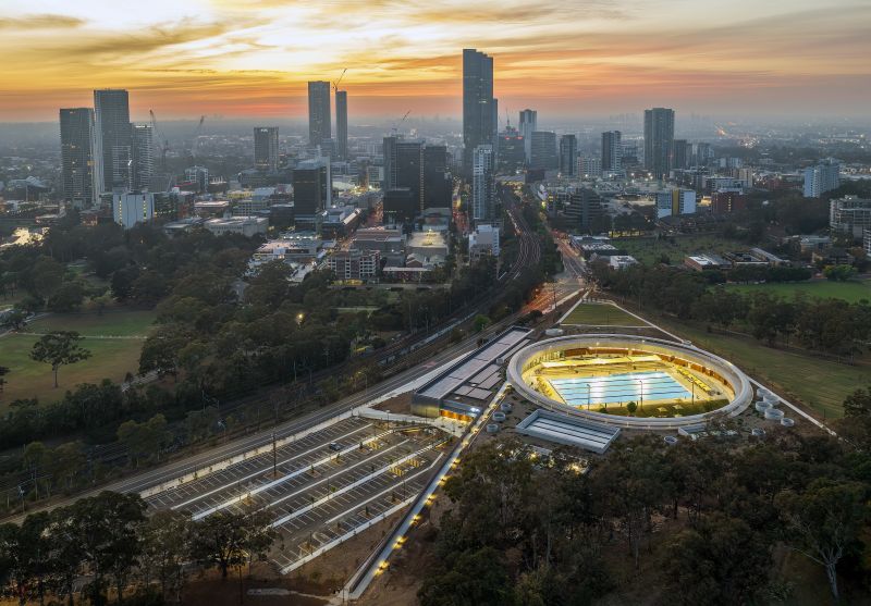Parramatta Aquatic Centre in the evening and Parramatta CBD in the background