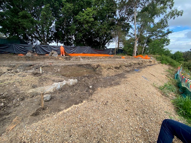 Worker putting up fence