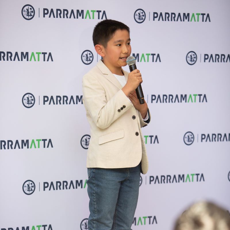 Boy speaking in a microphone