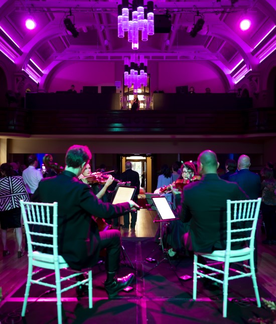 Concert Men and Women playing instruments